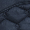 A dark navy blue quilted horse saddle pad with 'CAVALURE' embroidered in dark lettering on the top, featuring a diamond-quilted pattern and a small green logo patch near the bottom right, laid flat on a white background.